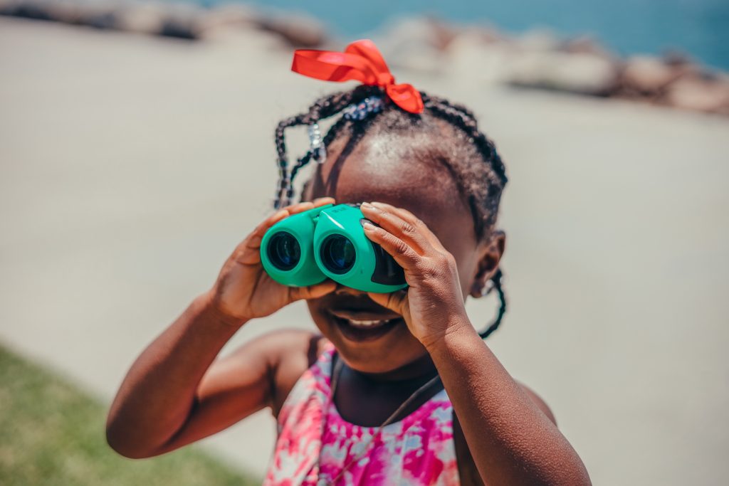 Child Looking Through Binoculars
